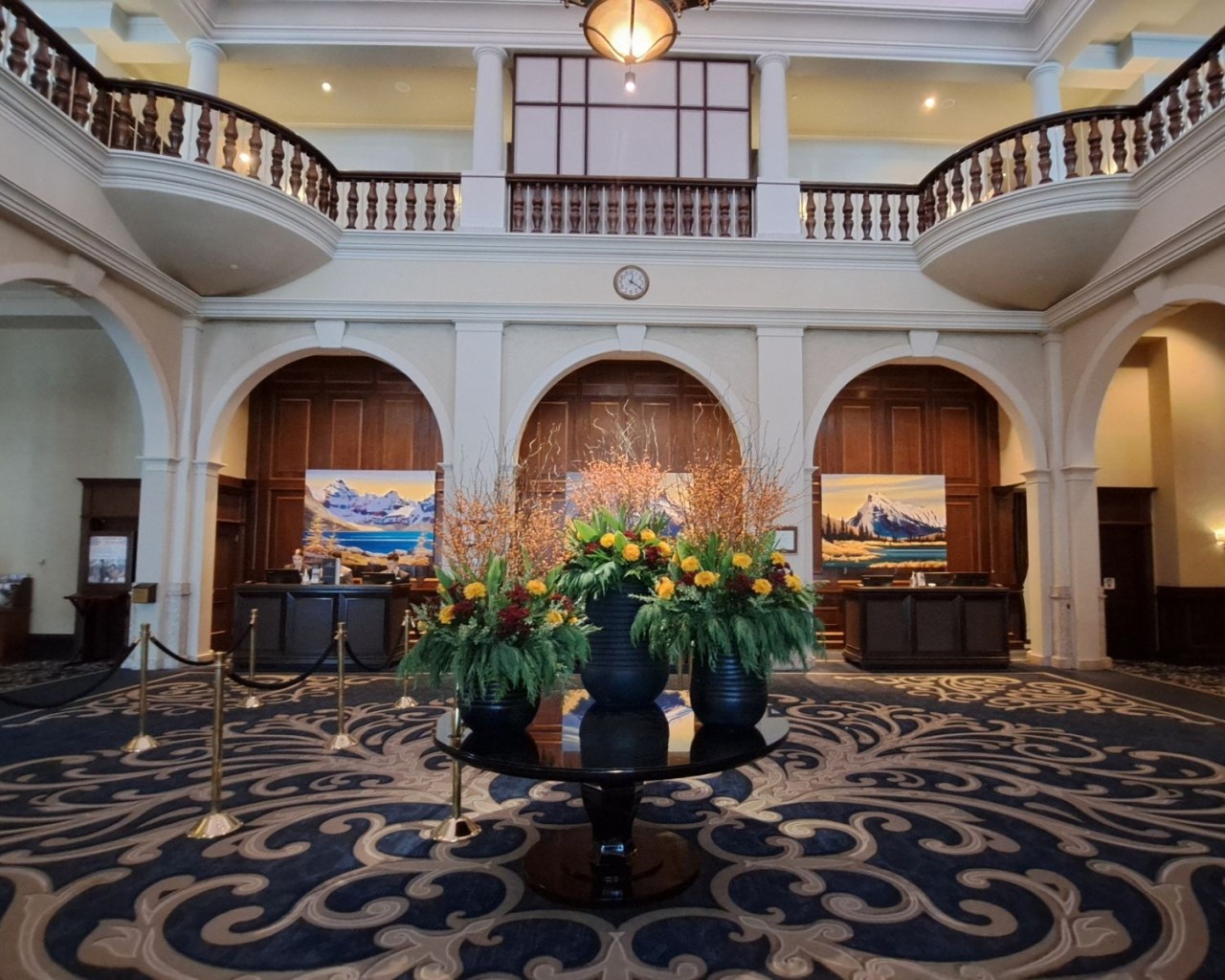 Grand Lobby with Alpine Charm and Scenic Mountain Backdrop - Warm wood accents, soaring mountain views, and a welcoming alpine atmosphere make the lobby feel like an elegant castle. It’s the perfect space before your next Stay in Banff Lake Louise adventure.
