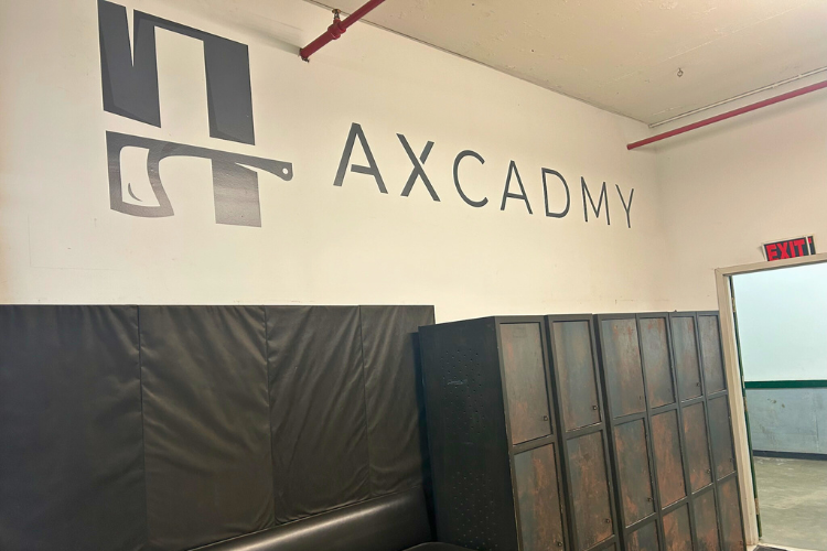 Axcadmy - Upon entering the Axcadmy blacksmith studio, visitors are greeted with welcoming signage.