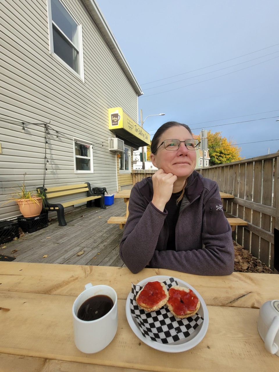 Breakfast with a View on the Battery Cafe's Outdoor Patio - A delicious breakfast spread of fresh-baked bagels with homemade jam at The Battery Cafe, set against the stunning backdrop of St. John's harbour, offering both local flavours and a memorable dining experience.
