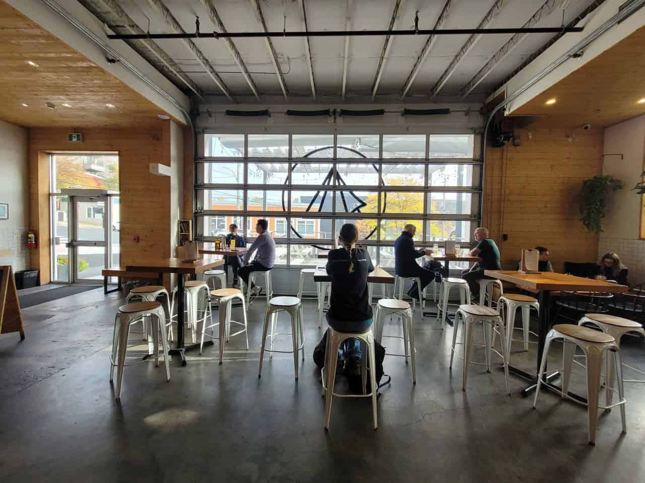 Modern, Open, and Inviting: Bannerman Brewing Co’s Industrial-Chic Taproom - Bannerman Brewing Co. in St. John's, Newfoundland features a modern taproom that blends industrial charm with an open, airy design. Large windows, exposed brick, and communal tables create a welcoming space to relax and enjoy craft beer.