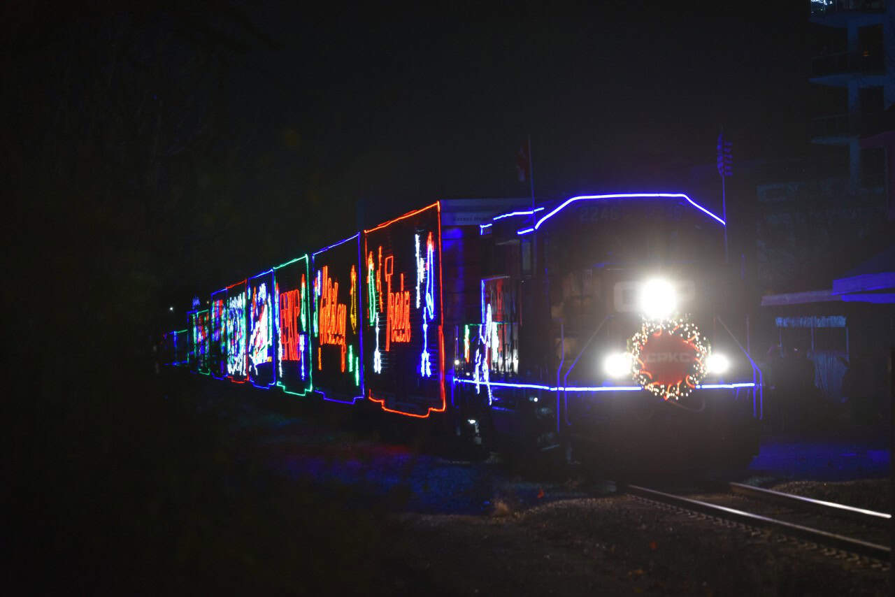 The CPKC Holiday Train Arrives in London, Ontario, Canada - The CPKC Holiday Train rolls into London, Ontario, greeted by a crowd of excited spectators along the tracks. A beloved annual tradition, it brings festive cheer to communities across Canada and the U.S.