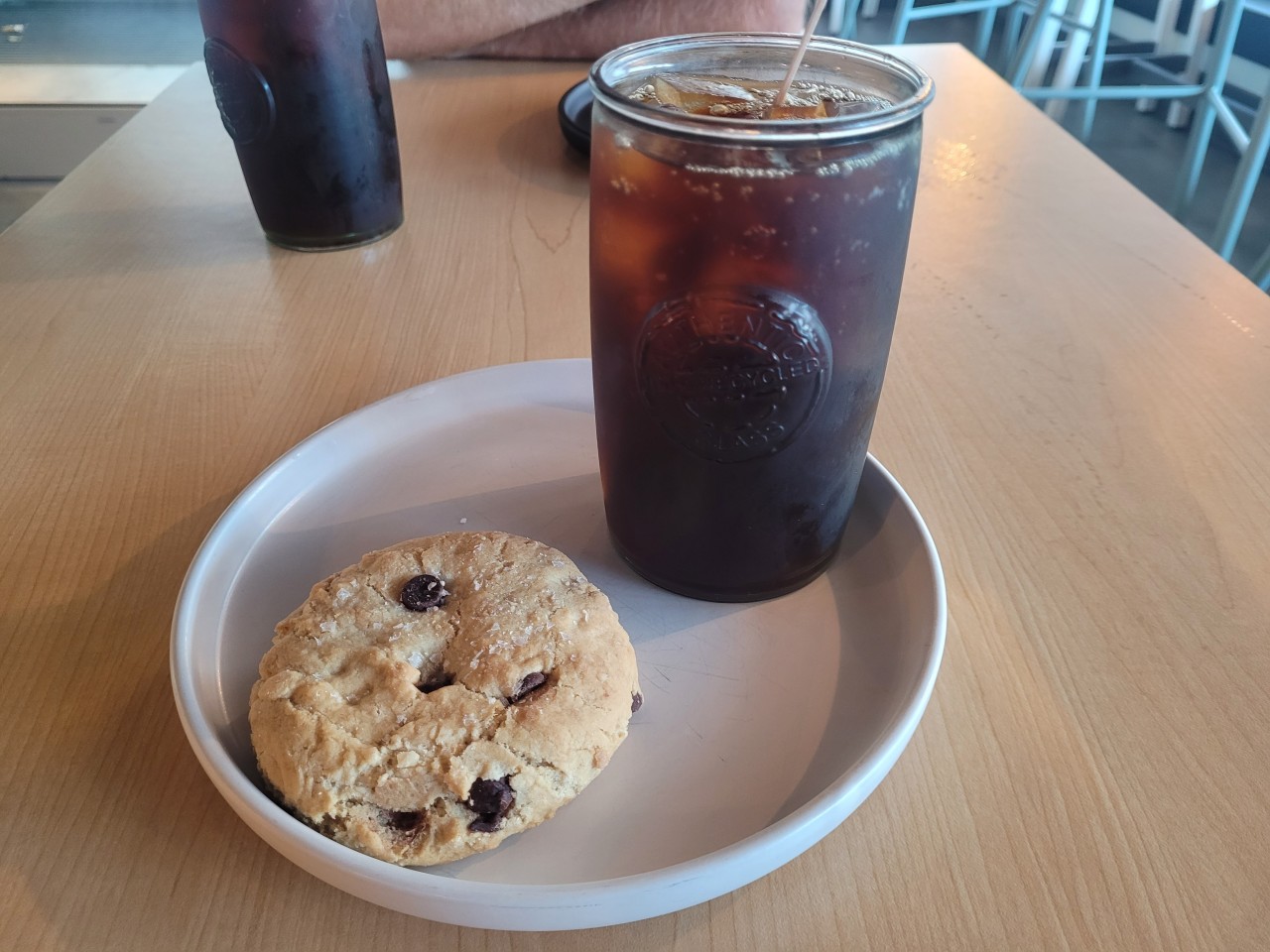 Enjoying an Iced Coffee at the Boreal Café, St. John's, Newfoundland - A delicious cup of locally brewed coffee served with a tasty pastry at St. John's Boreal Café. This café offers a warm and inviting atmosphere for both locals and tourists alike.