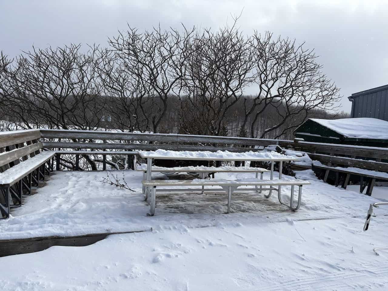 Hill-top-Fire-Pit-and-Seating-Area - The bench and fire pit provided a warm and cozy spot for visitors to sit and warm up around the fire.