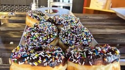 bakery-red-deer-chocolate-sprinkle-donut