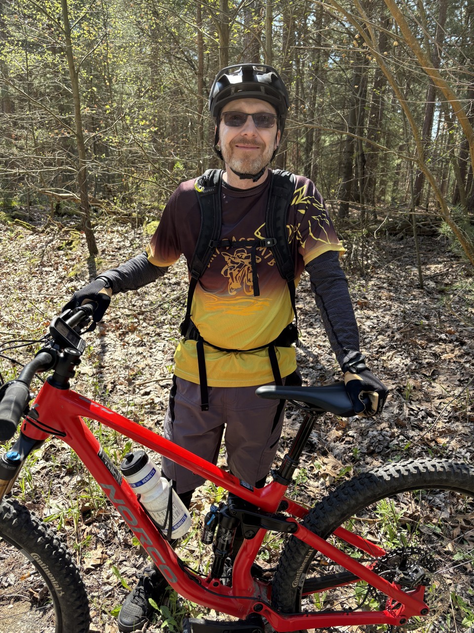 Smiling-for-a-Perfect-Day-for-Mountain-Biking - Tim is smiling because riding a mountain bike is one of his favourite things to do. The Spring Kicker is an event to support the Turkey Point Mountain Bike Club and all of the work that they do to maintain the trails for riders to enjoy.