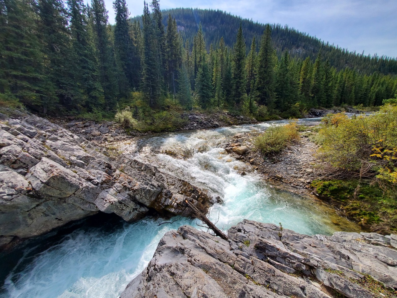 Canyon River Views at Hummingbird Falls - Turquoise river water cuts through rocky canyon walls near Hummingbird Falls in Alberta’s foothills