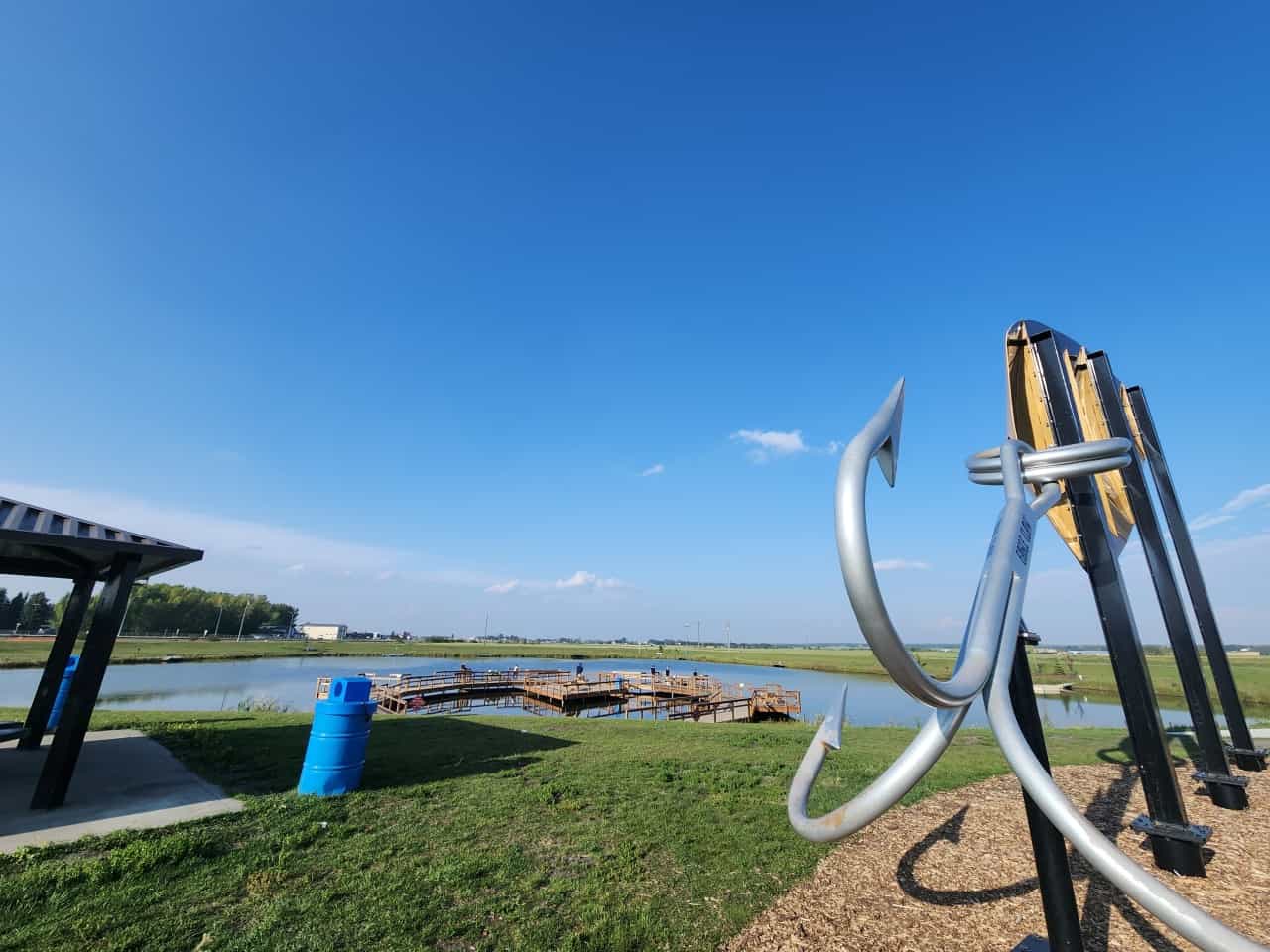 Picnic Tables, Fishing Pond and the World's Largest Fishing Lure  - Have a picnic, catch a fish and enjoy the World's Largest Fishing Lure at the Len Thompson Trout Pond in Lacombe Alberta 