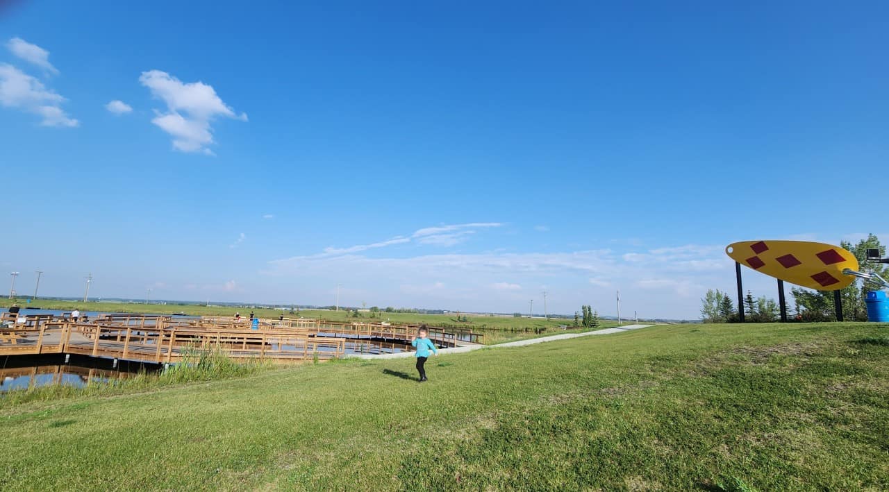 Views of the World's Largest Fishing Lure and Len Thompson Trout Pond  - The Worlds Largest Fishing Lure sits proudly above the Len Thompson Trout Pond and accessibility dock in Lacombe Alberta Canada 